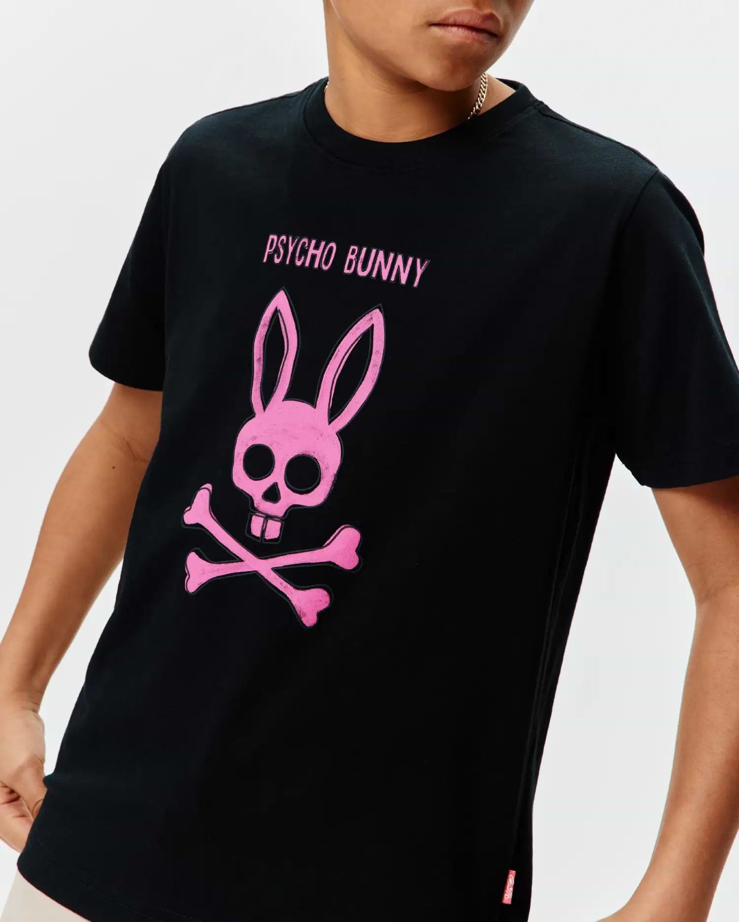 Black cotton jersey Kids Adler Graphic Tee with a large, distressed pink Psycho Bunny skull and crossbones graphic and PSYCHO BUNNY text on the chest, in a classic fit.
