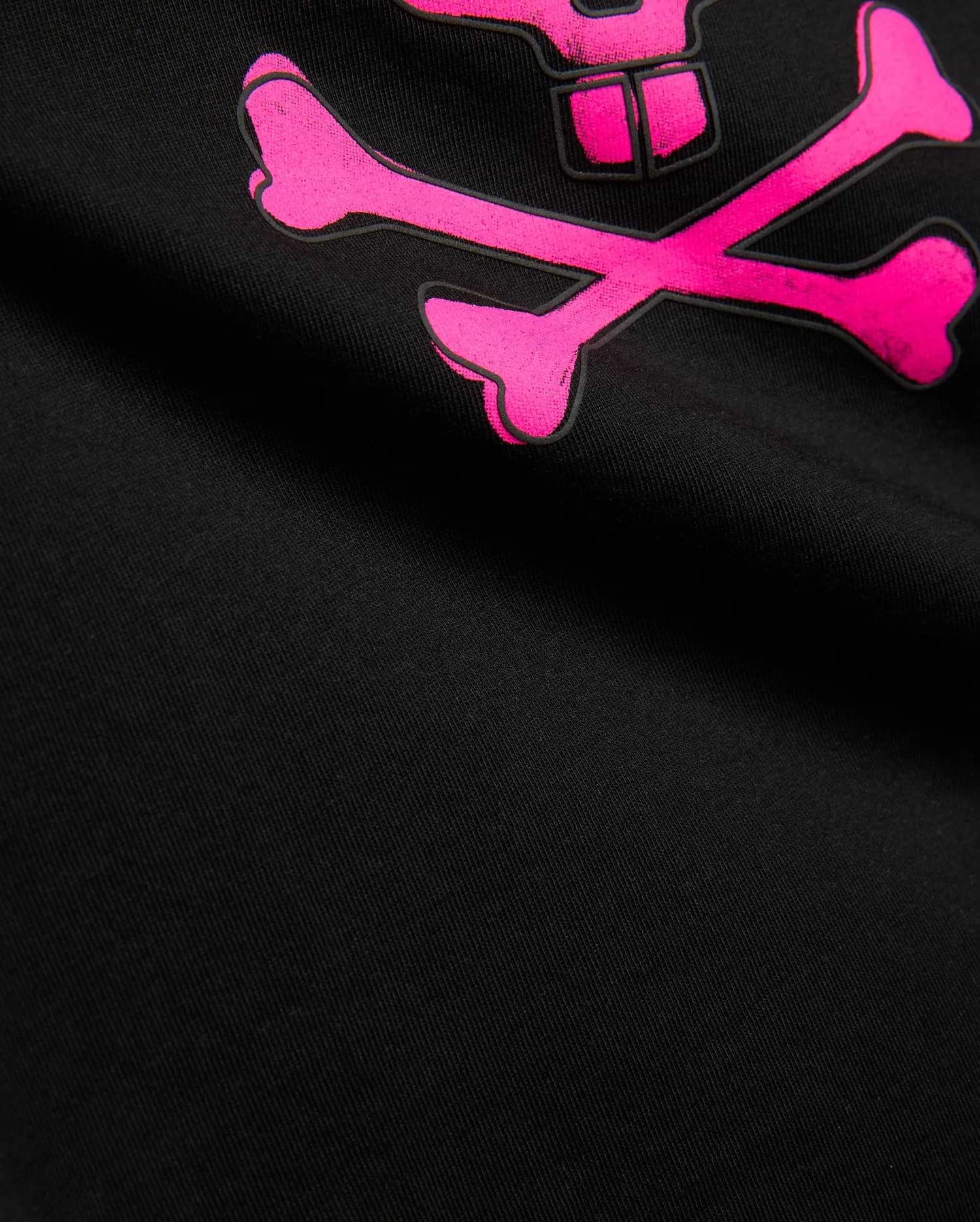 Kids Adler Graphic Tee, black soft jersey knit t-shirt featuring a large, vibrant pink Psycho Bunny skull and crossbones graphic print with a black outline.