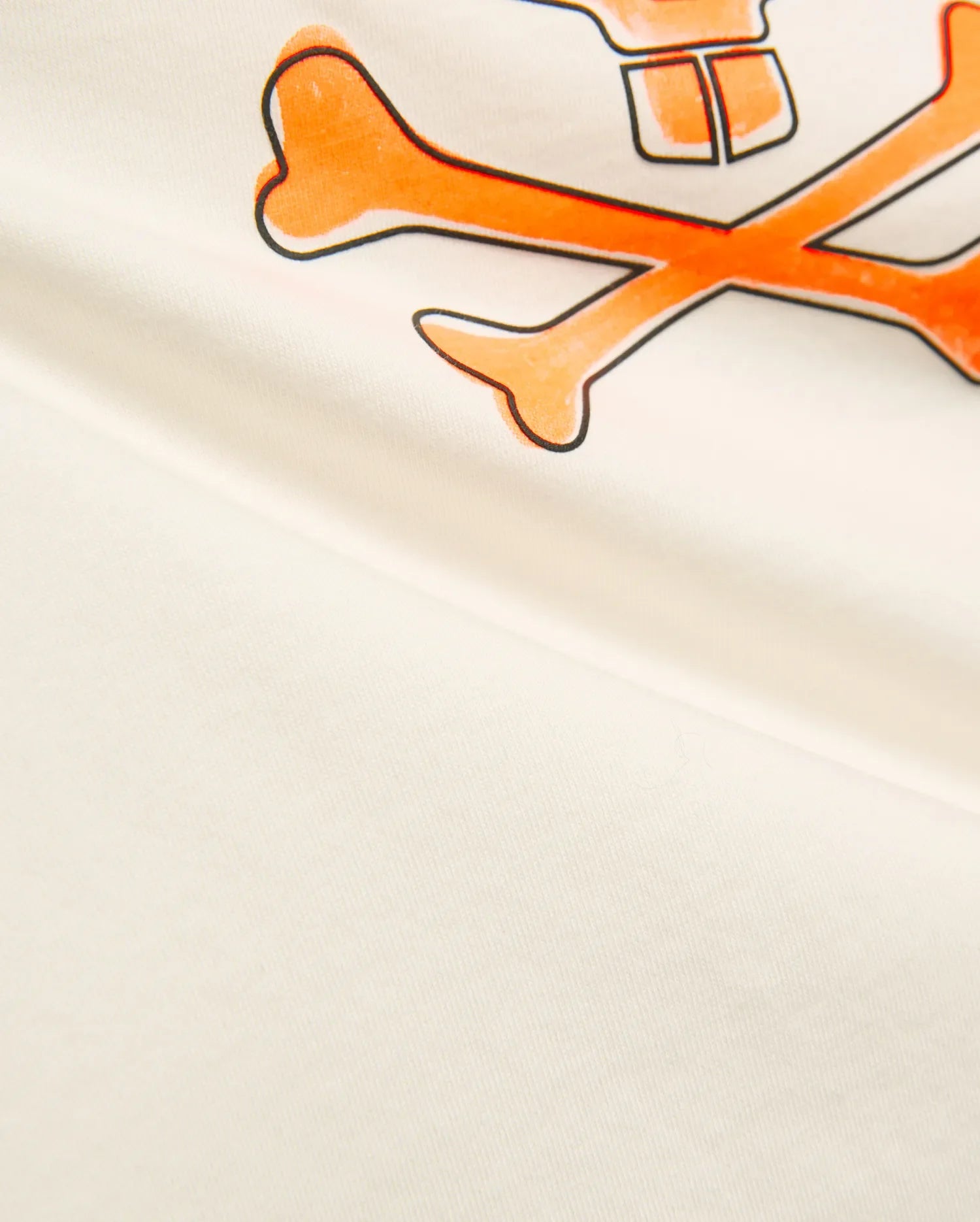 Kids Adler Graphic Tee in soft cream jersey knit, featuring a prominent, large orange and black outlined Psycho Bunny skull and crossbones graphic print on the chest.