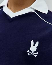 Navy Kids Toby Jersey classic fit polo shirt, featuring a white ribbed collar, white piping detail, and a small white embroidered Psycho Bunny skull logo on the left chest.