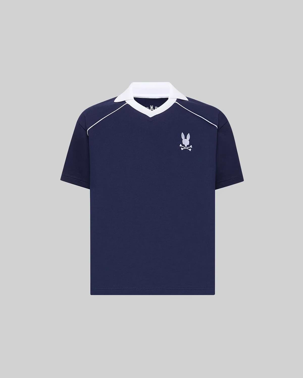 Kids Toby Jersey in navy blue, featuring a white spread collar, white shoulder piping, and an embroidered white Psycho Bunny skull logo on the left chest. Relaxed fit jersey knit.
