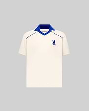 Kids Toby Jersey cream jersey polo with royal blue ribbed V-neck spread collar, V-neck and shoulder piping, and embroidered Psycho Bunny skull logo on the left chest, classic fit.