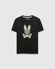 Kids Brad Graphic Tee, black jersey t-shirt with a large white Psycho Bunny skull and crossbones graphic on the chest, featuring a pattern of small bunny logos and palm trees. Classic fit.