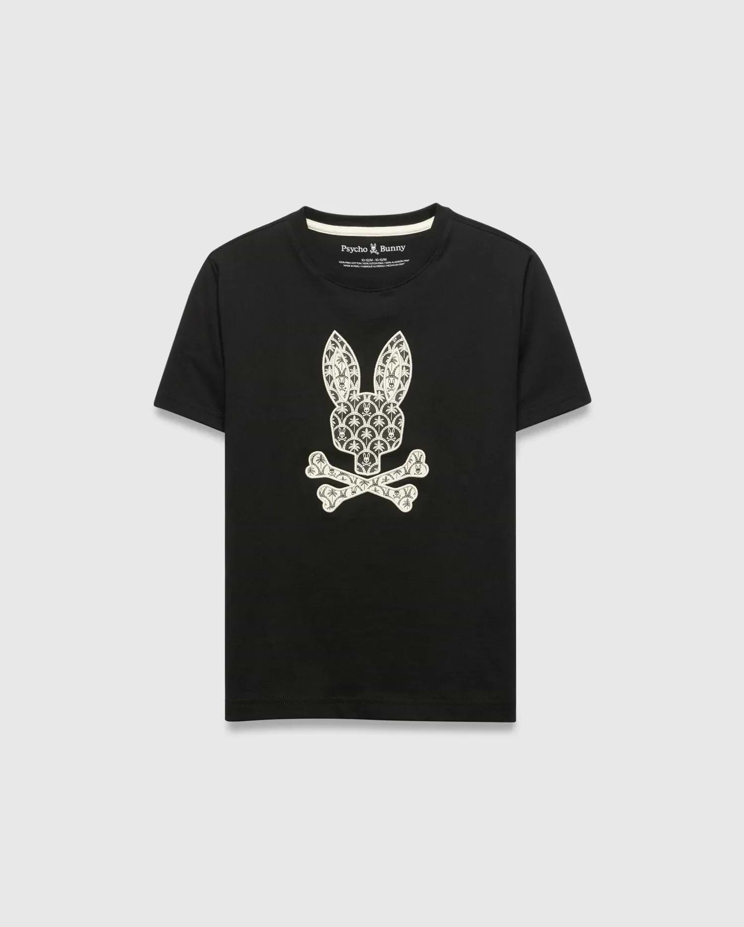 Kids Brad Graphic Tee, black jersey t-shirt with a large white Psycho Bunny skull and crossbones graphic on the chest, featuring a pattern of small bunny logos and palm trees. Classic fit.