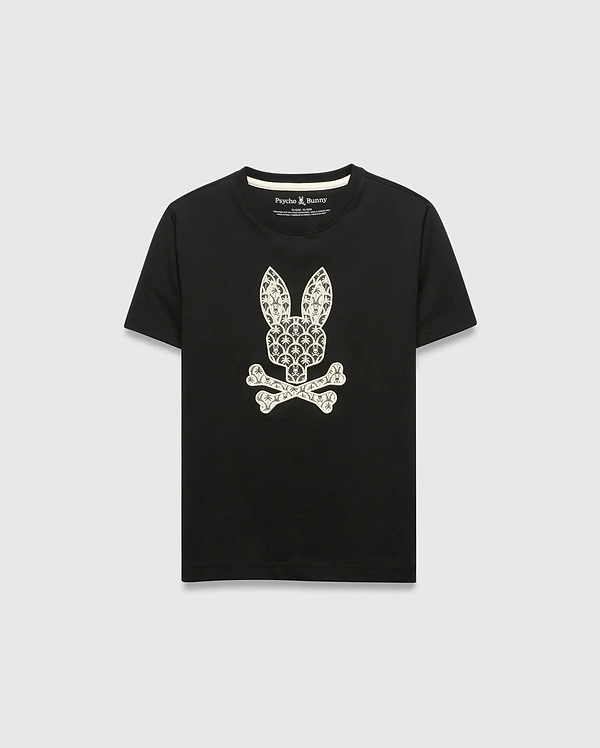 Kids Brad Graphic Tee, black jersey t-shirt with a large white Psycho Bunny skull and crossbones graphic on the chest, featuring a pattern of small bunny logos and palm trees. Classic fit.