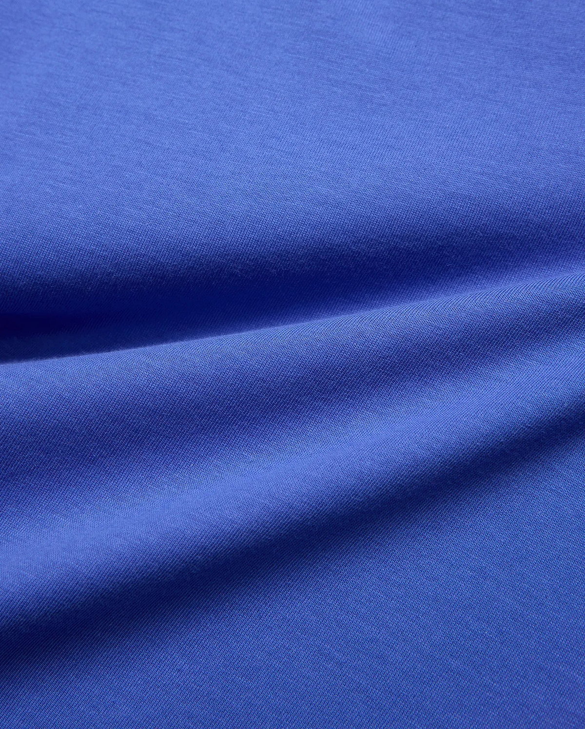Vibrant blue jersey knit fabric swatch, smooth and subtly textured, for the Kids Sunny Chest Graphic Tee, designed for a comfortable, classic fit.