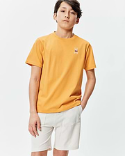 Kids Sunny Chest Graphic Tee, a classic fit sunny orange jersey t-shirt featuring a small embroidered Psycho Bunny skull with sunglasses and crossbones on the left chest.