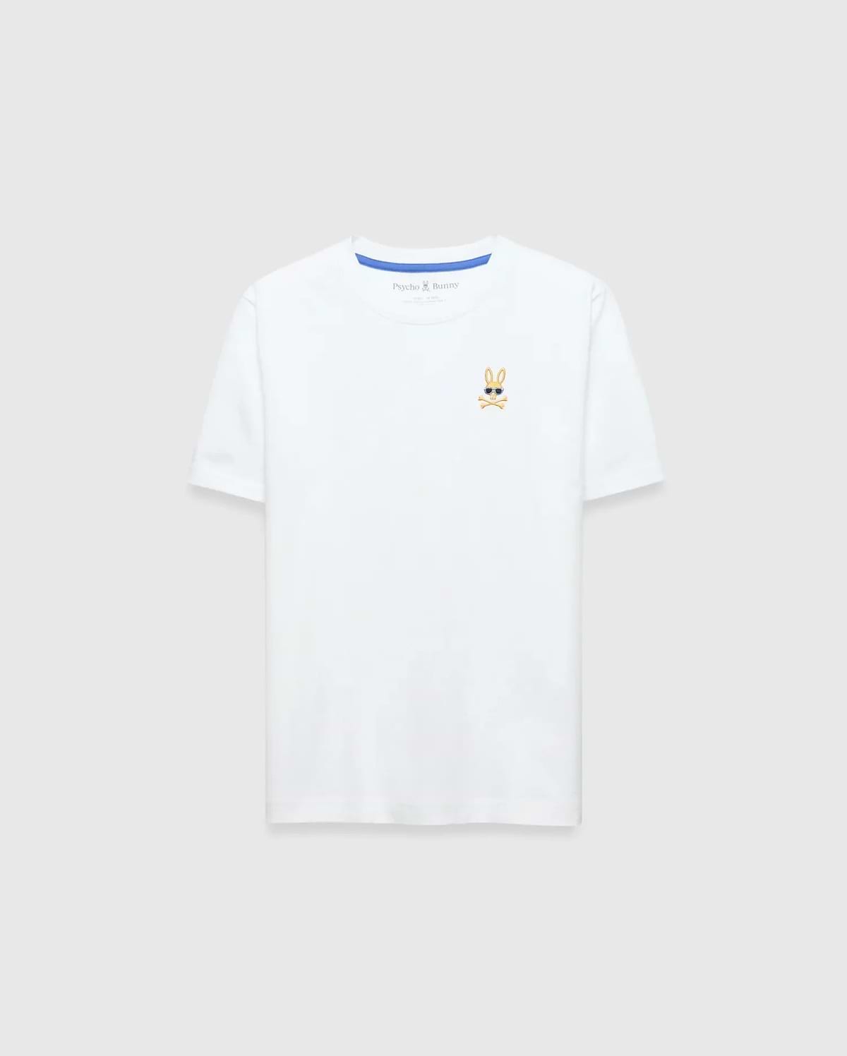 Kids Sunny Chest Graphic Tee, a classic fit white jersey t-shirt featuring a small, embroidered gold and black Psycho Bunny skull logo with sunglasses on the left chest and blue neck tape.