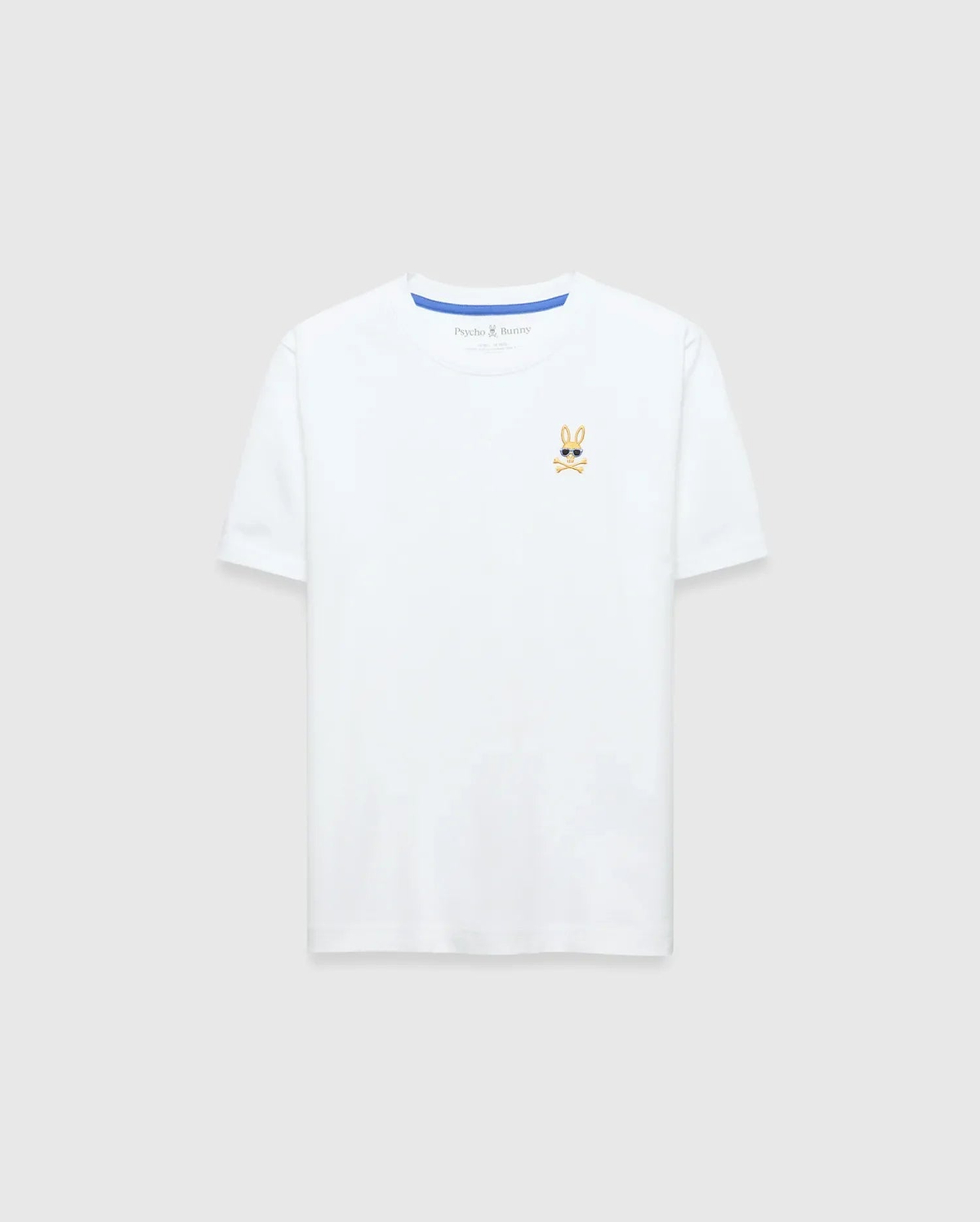 Kids Sunny Chest Graphic Tee, a classic fit white jersey t-shirt featuring a small, embroidered gold and black Psycho Bunny skull logo with sunglasses on the left chest and blue neck tape.