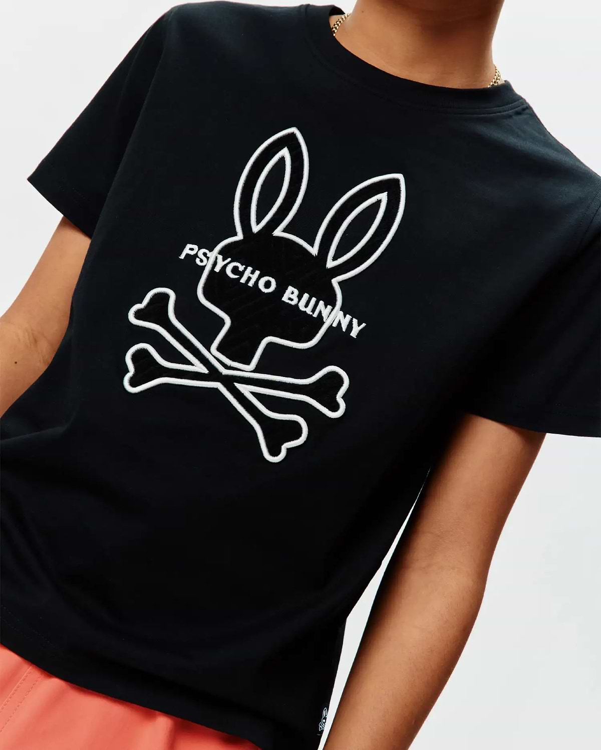 Kids Craig Graphic Tee, black classic fit jersey t-shirt featuring a large white Psycho Bunny skull and crossbones graphic print with text on the chest. (3)