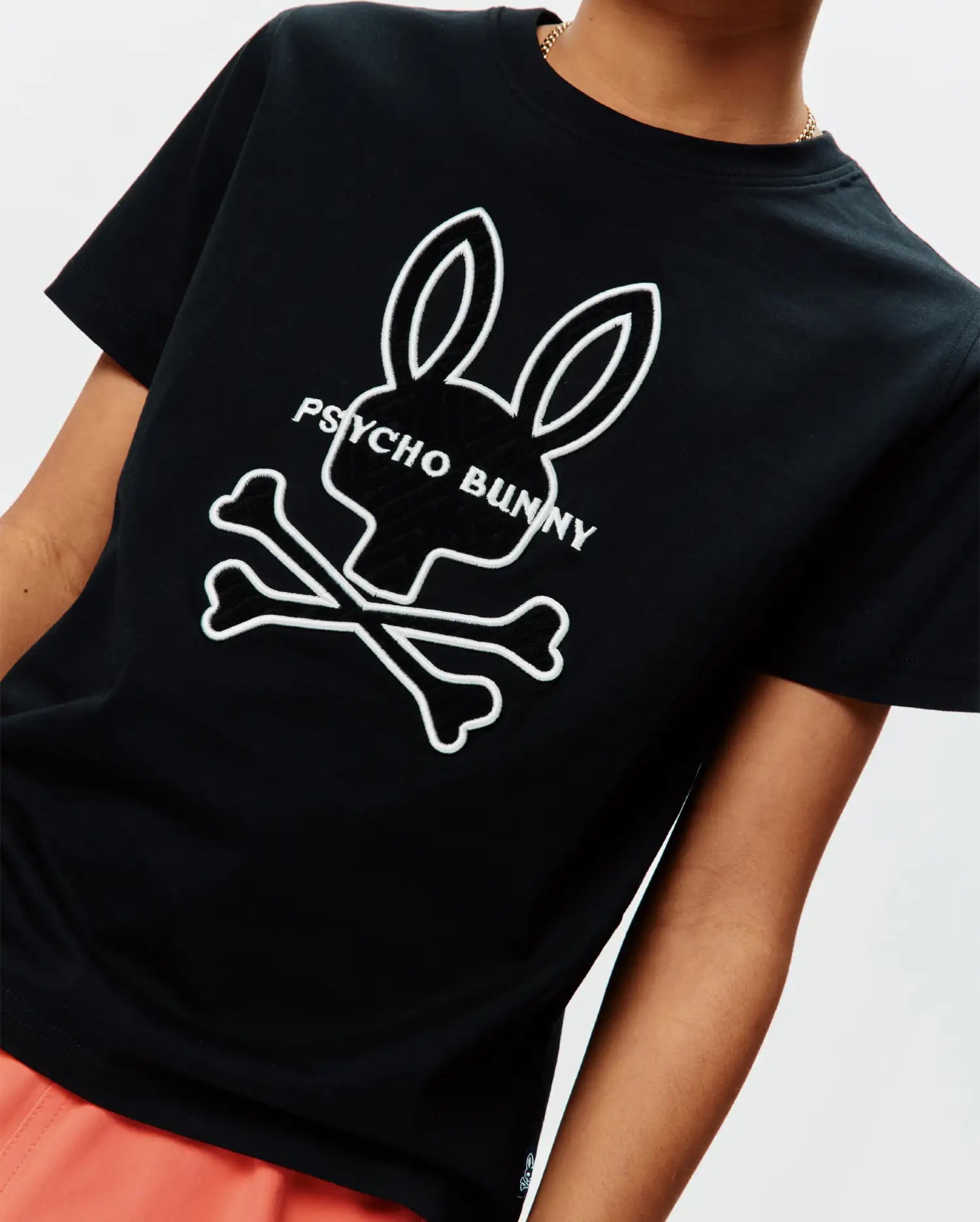 Kids Craig Graphic Tee, black classic fit jersey t-shirt featuring a large white Psycho Bunny skull and crossbones graphic print with text on the chest. (3)