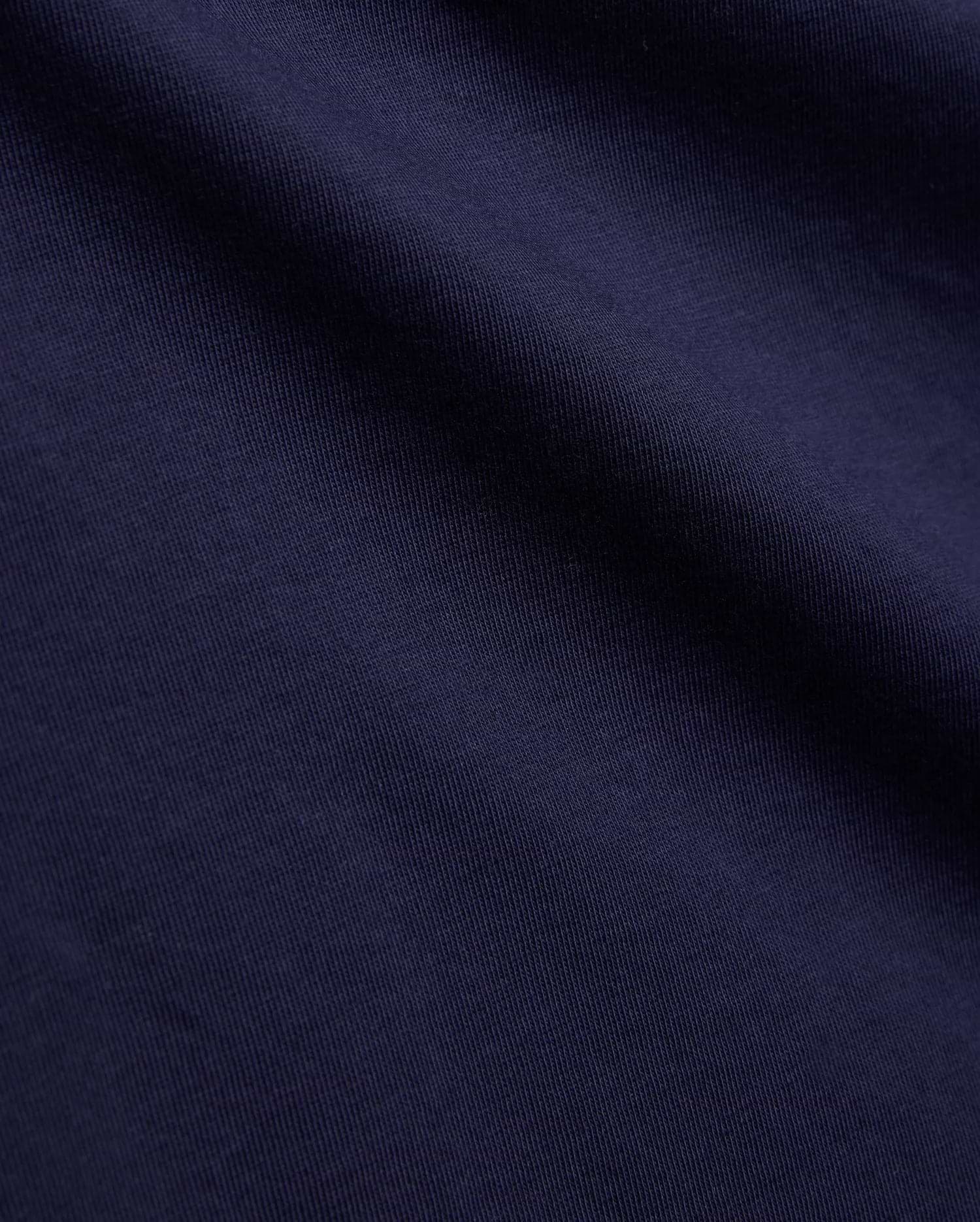 Psycho Bunny Kids Tanner Graphic Tee, crafted from premium deep navy blue jersey knit fabric, showcasing a fine vertical rib texture, smooth feel, and soft, natural drape.