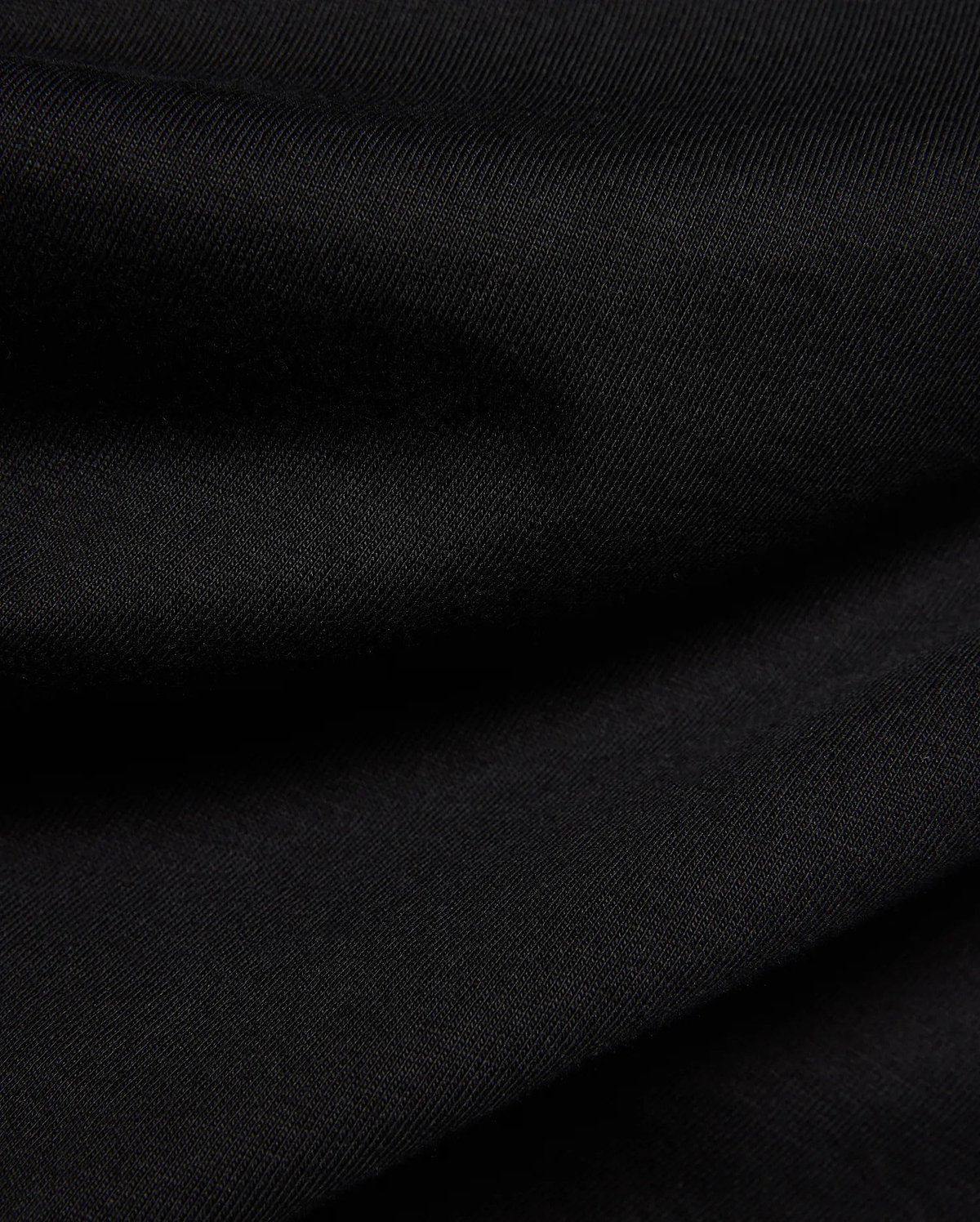 Psycho Bunny Kids Frank Back Graphic Tee in a rich black, soft jersey knit fabric with a subtle diagonal rib texture, featuring a bold back graphic.