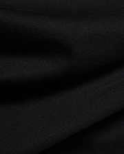 Psycho Bunny Kids Frank Back Graphic Tee in a rich black, soft jersey knit fabric with a subtle diagonal rib texture, featuring a bold back graphic.