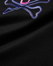 Kids Dayton Graphic Tee, black jersey t-shirt featuring a large, central raised Psycho Bunny skull logo graphic in vibrant neon pink and blue gradient, classic fit.