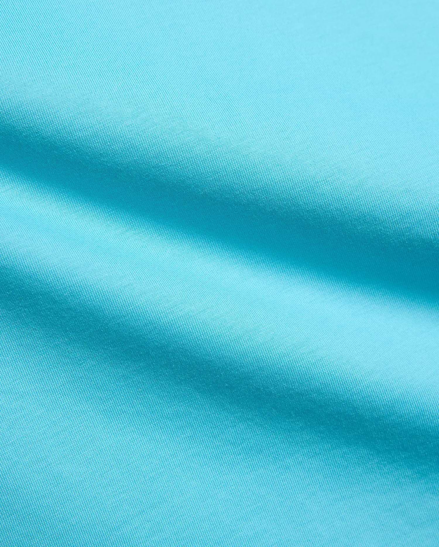 Kids Isaac Relaxed Fit Tee in vibrant aqua blue, crafted from soft jersey knit fabric, featuring the iconic small embroidered Psycho Bunny skull logo on the chest.