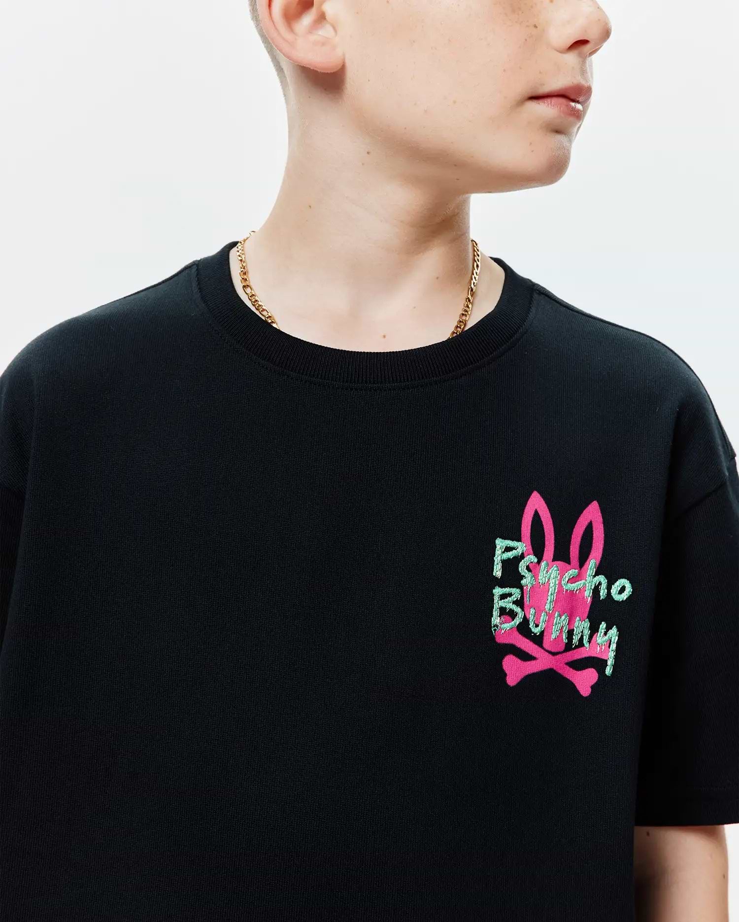 Black Kids Duncan Relaxed Fit Tee, a relaxed fit jersey knit shirt with a large embroidered hot pink bunny skull and neon green Psycho Bunny text on the left chest.