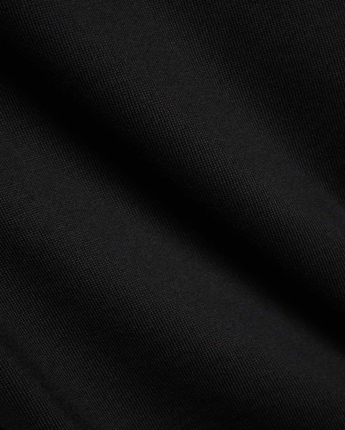 Kids Duncan Relaxed Fit Tee, a premium black jersey tee featuring a soft, finely woven texture, embodying Psycho Bunny's refined streetwear comfort.