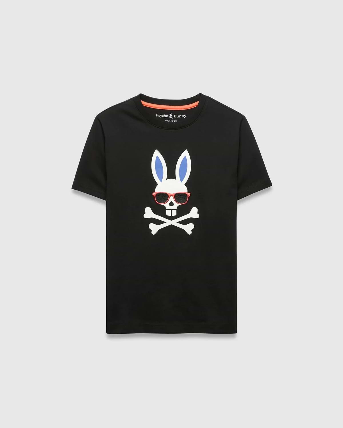 Black Kids Sunny Graphic Tee, classic fit, smooth jersey, featuring a large white Psycho Bunny skull with blue ears, red sunglasses, and crossbones graphic print on the chest, with orange neck tape.
