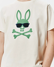Kids Sunny Graphic Tee, a cream classic-fit jersey t-shirt featuring a large central green Psycho Bunny skull and crossbones logo wearing embroidered dark blue sunglasses with black lenses.