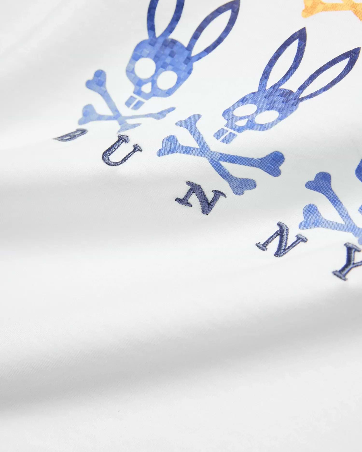 Kids Colt Graphic Tee in white jersey, featuring a large blue and orange gradient Psycho Bunny skull and crossbones graphic with embroidered dark blue BUNNY letters.