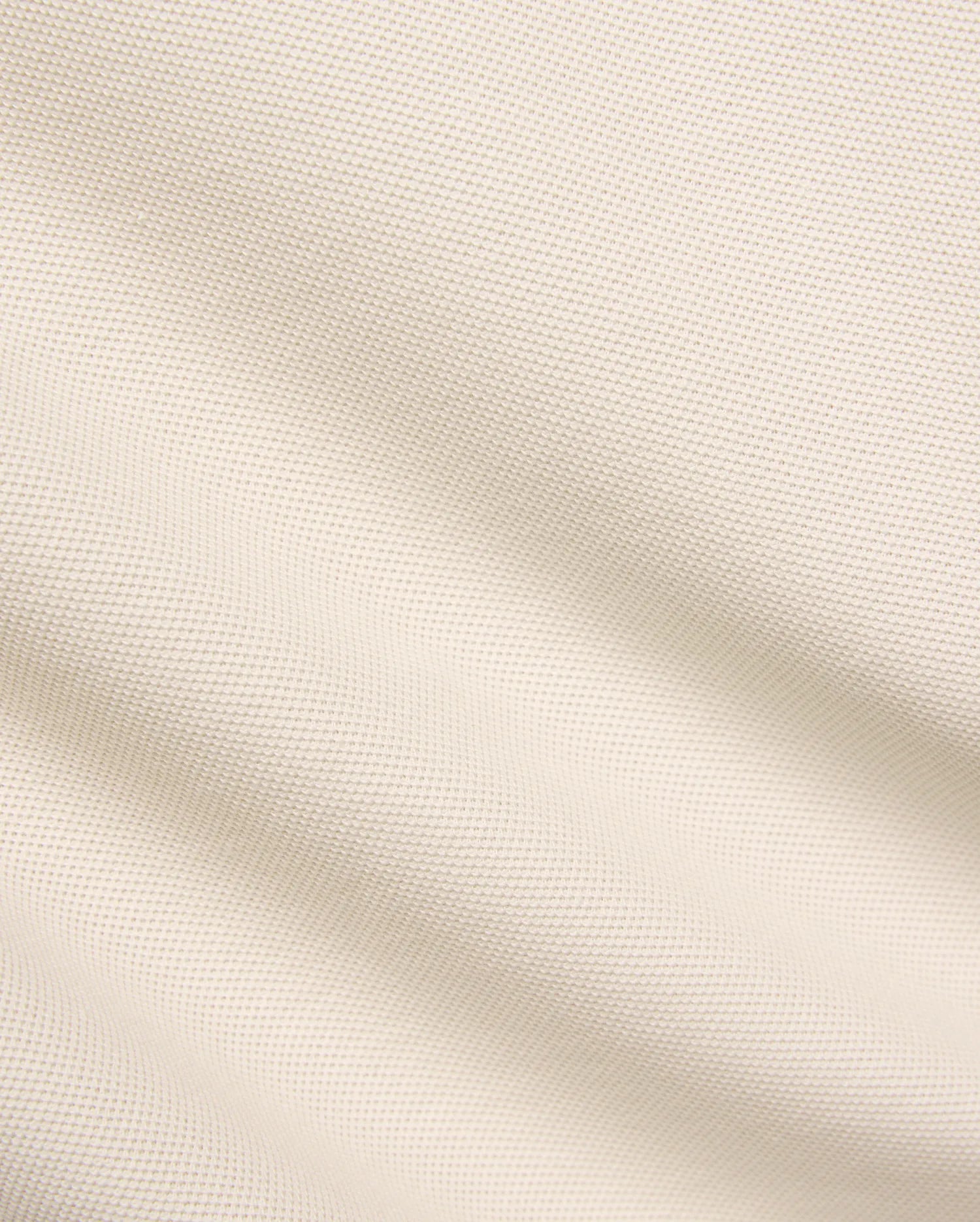 Kids Taylor Pique Tee fabric swatch, a premium light beige pique knit with a subtle, refined texture, embodying the brand's quality for comfortable, stylish streetwear.