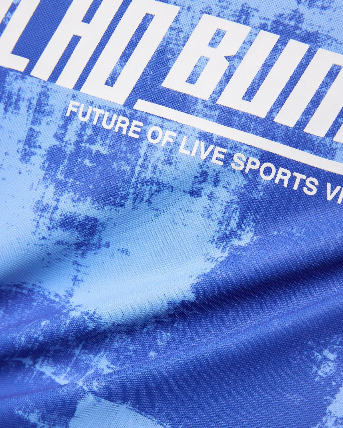 Kids Micah Oversized Soccer Jersey in royal blue with a light blue distressed abstract pattern, featuring a large white graphic print of Psycho Bunny text and FUTURE OF LIVE SPORTS.