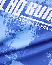 Kids Micah Oversized Soccer Jersey in royal blue with a light blue distressed abstract pattern, featuring a large white graphic print of Psycho Bunny text and FUTURE OF LIVE SPORTS.