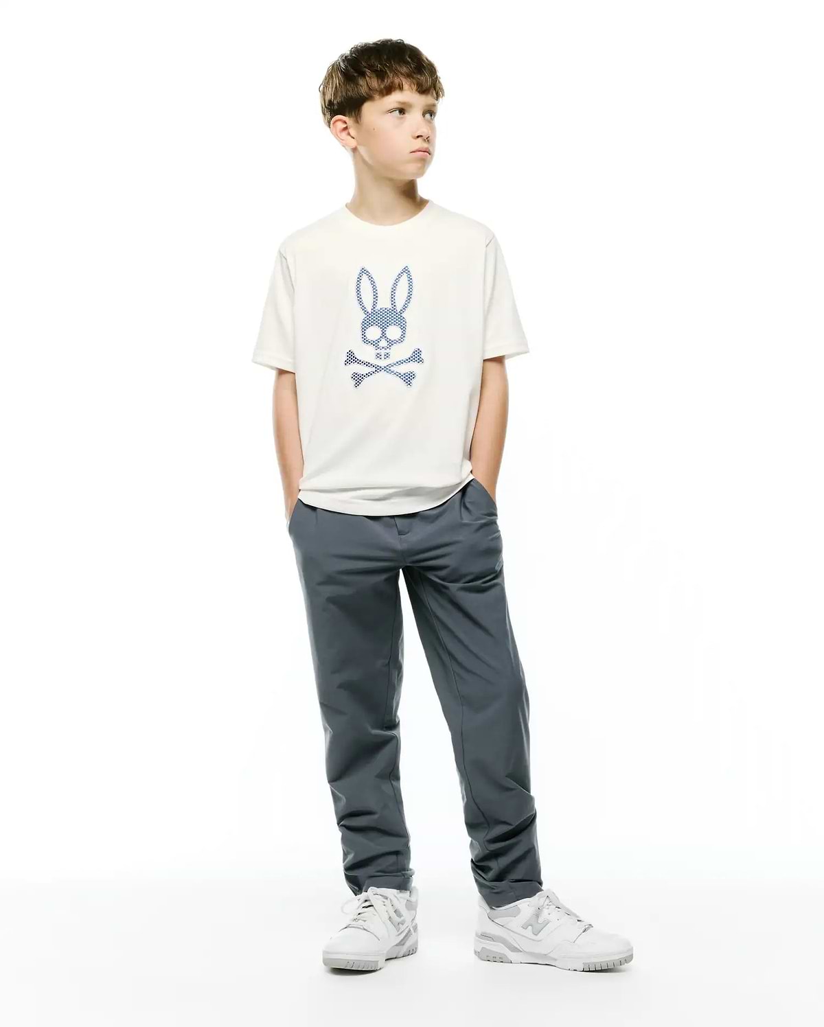 KIDS STAN GRAPHIC TEE: Cream classic fit jersey t-shirt featuring a large, centered blue checkered Psycho Bunny skull and crossbones logo on the chest.
