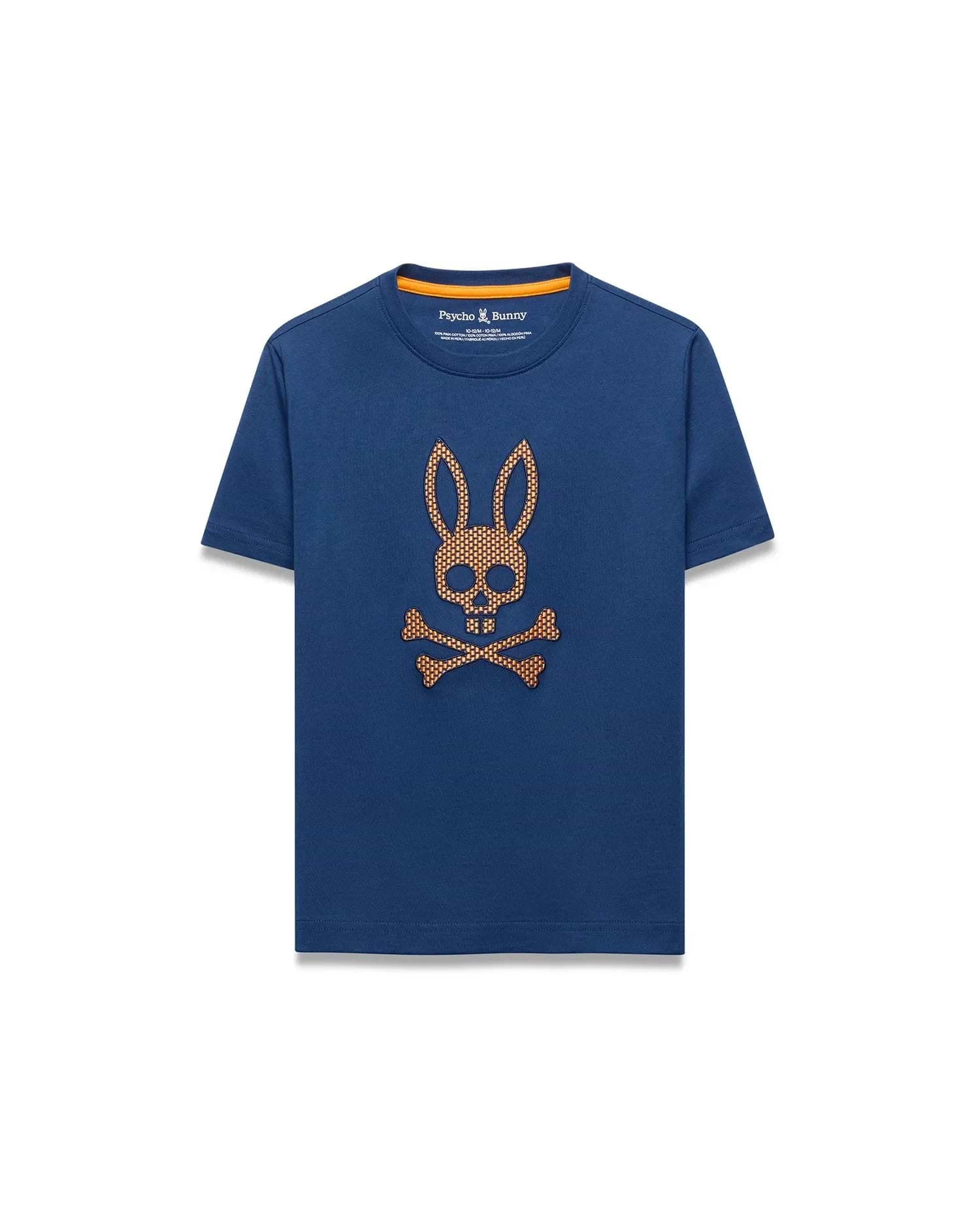 Kids Stan Graphic Tee. Navy blue classic fit jersey t-shirt with an orange neck trim and a large, central, textured orange/gold Psycho Bunny skull logo featuring a grid pattern.