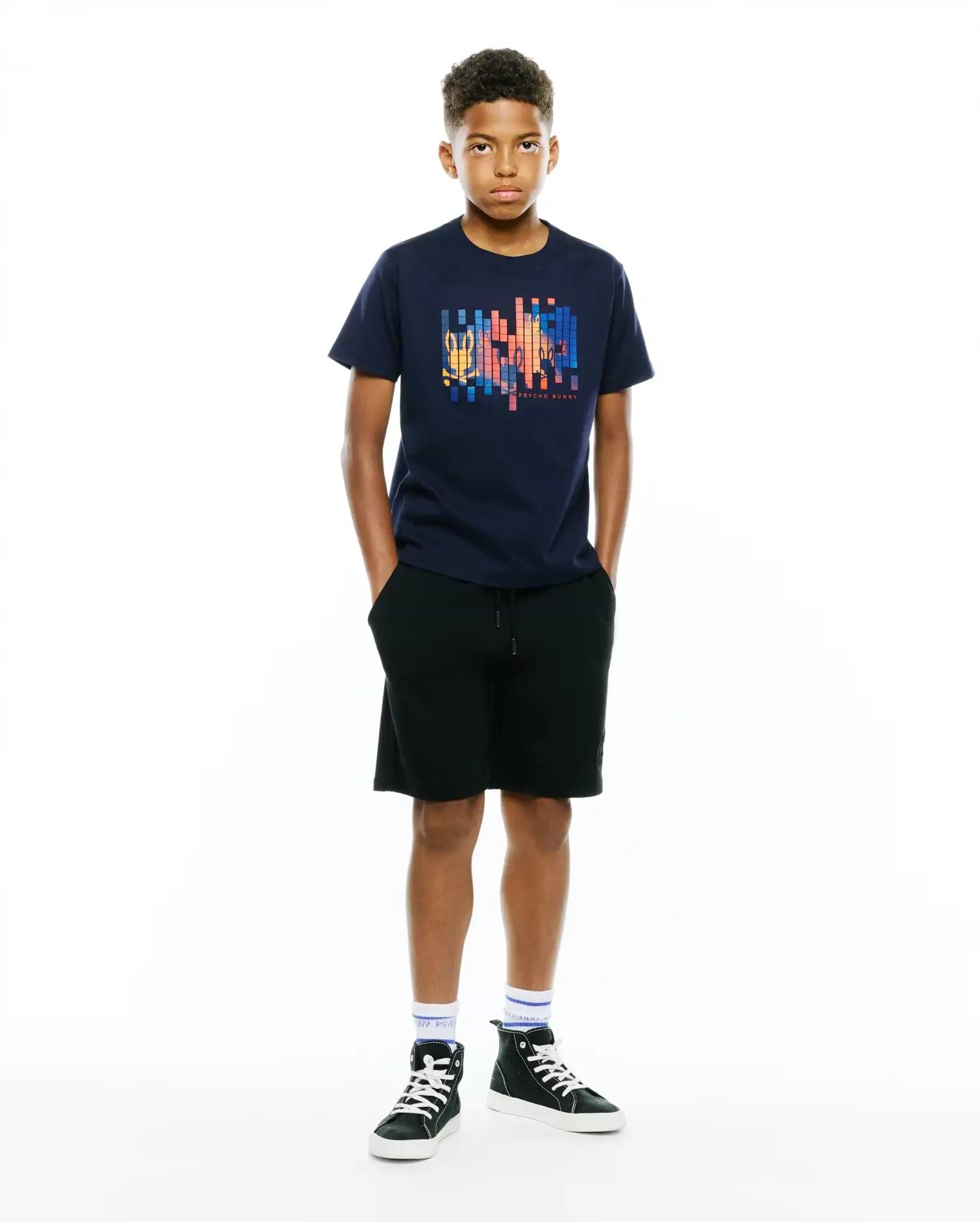Kids Zander Graphic Tee in navy, featuring a classic fit and soft jersey fabric. A large, multicolor pixelated graphic with the Psycho Bunny skull logo and text is centered on the chest.