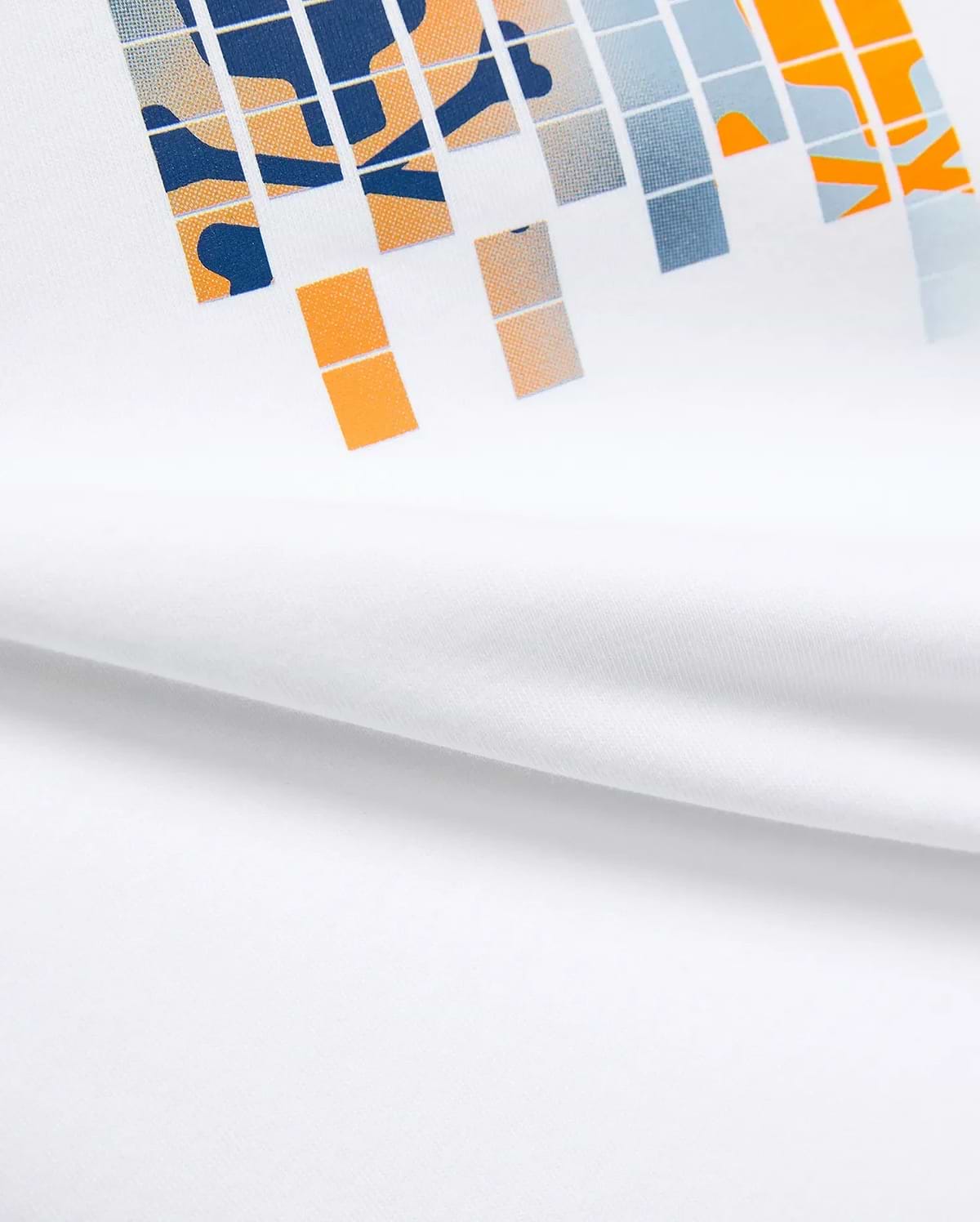 Kids Zander Graphic Tee, white jersey t-shirt with a large, bold pixelated chest graphic in navy, orange, and light blue, featuring abstract shapes for a modern streetwear look.