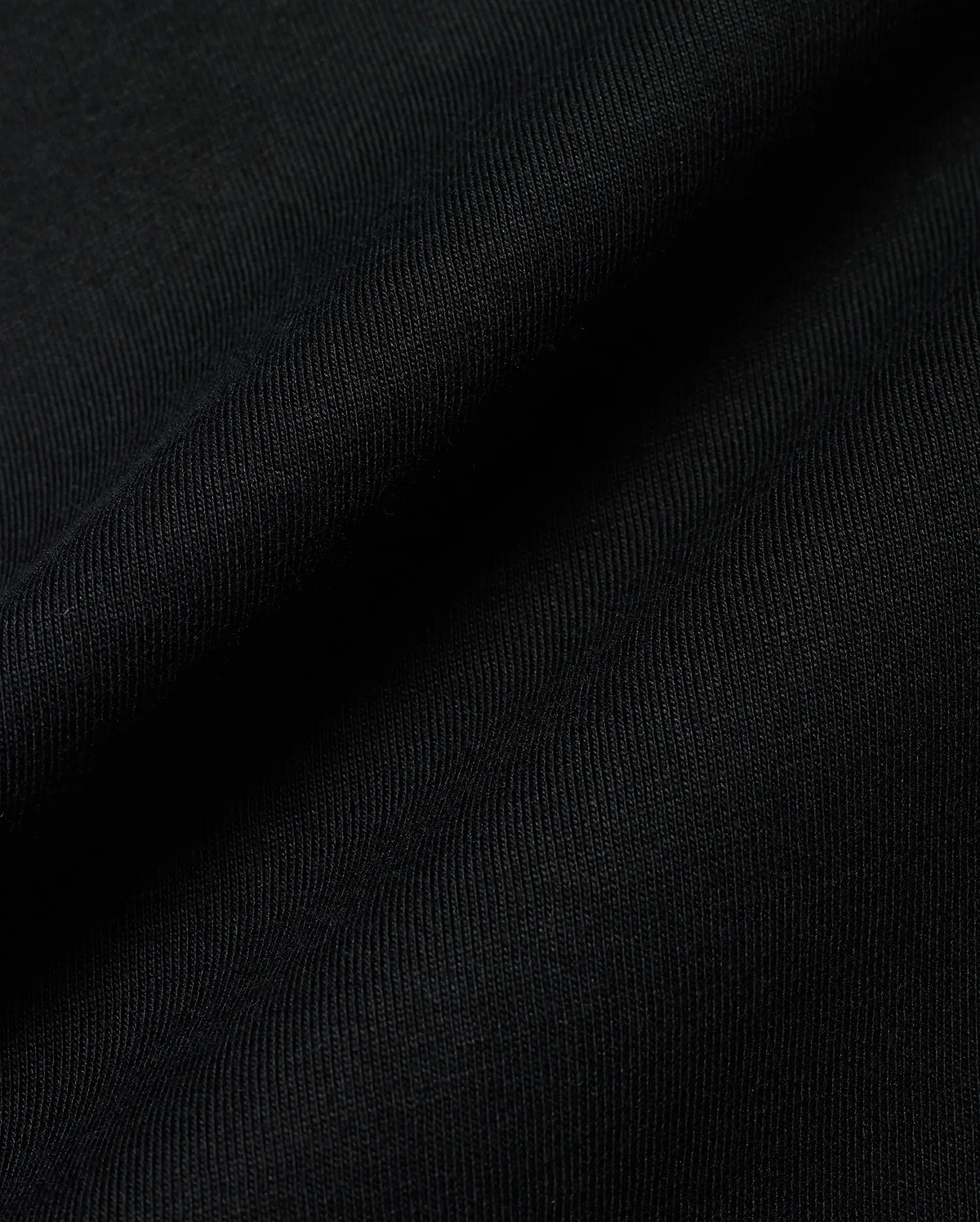 Premium black Kids Conan Back Graphic Tee, crafted from soft, finely ribbed jersey fabric, hinting at a bold back graphic for refined streetwear style.