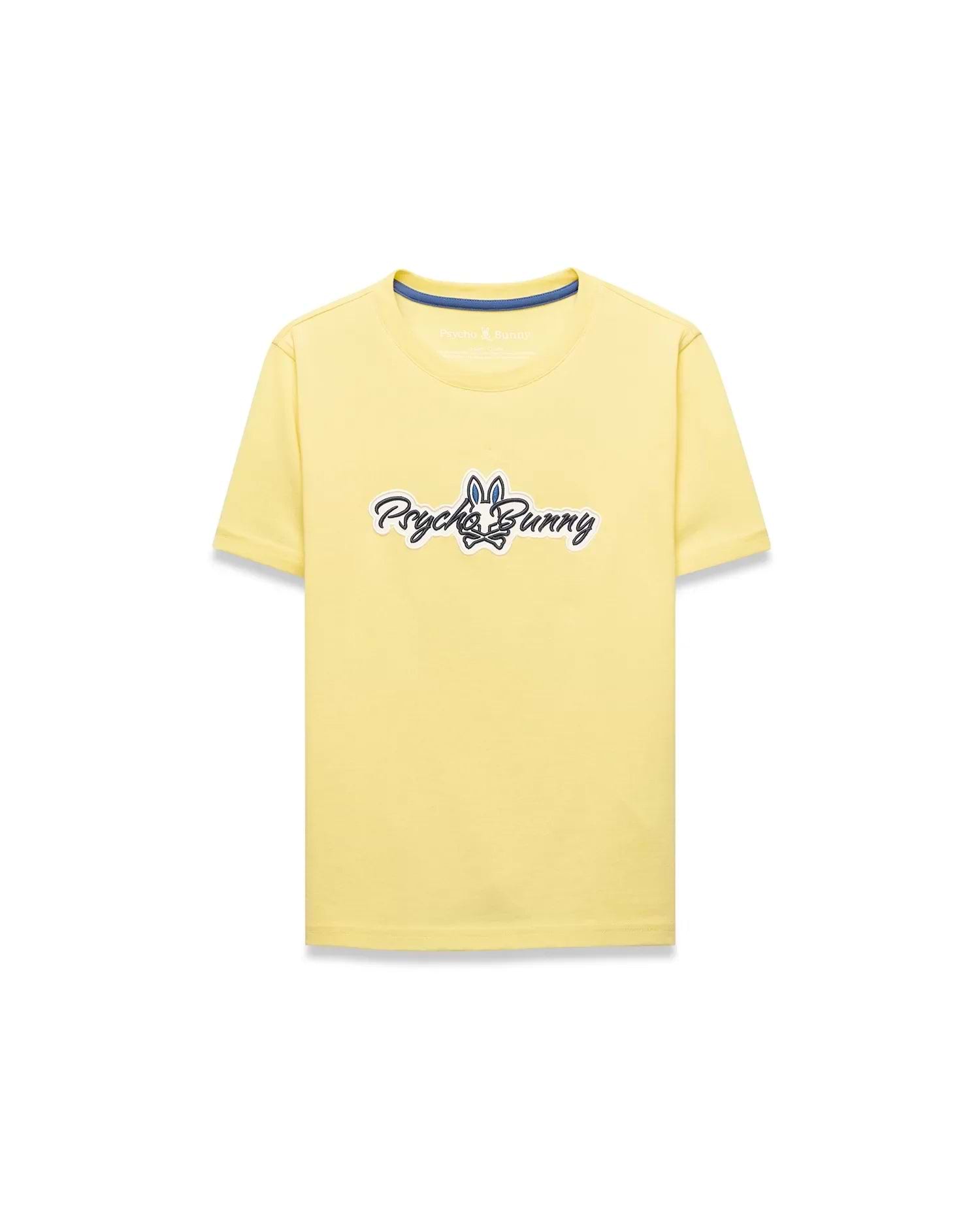 Kids Jaydon Wordmark Graphic Tee, a classic fit pale yellow jersey t-shirt featuring a large central chest graphic of the Psycho Bunny wordmark and skull logo in black, white, and blue.