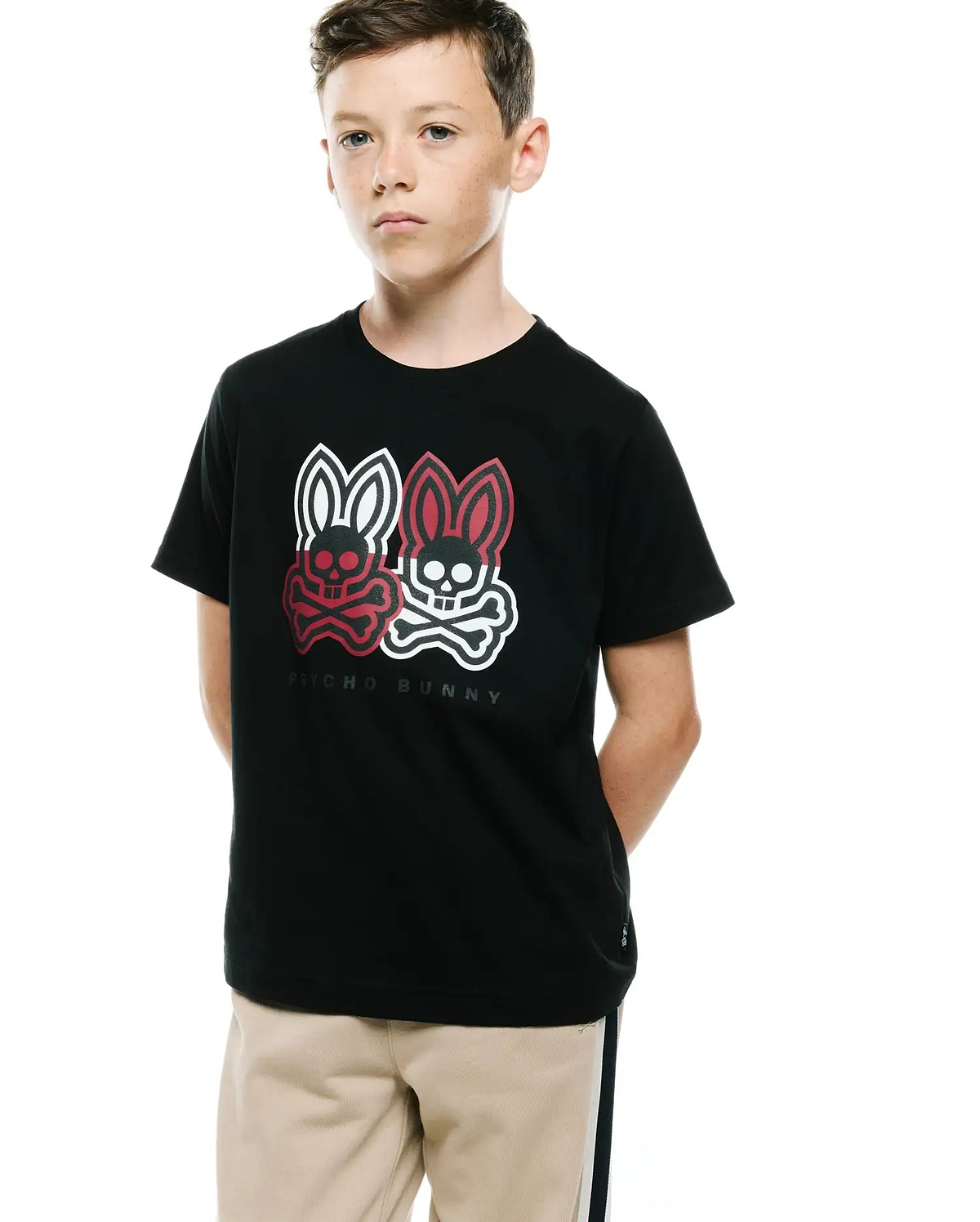 Black Kids Ledger Graphic Tee, classic fit jersey knit, featuring a large chest print of two Psycho Bunny skull logos in white and red with crossbones, and PSYCHO BUNNY text.