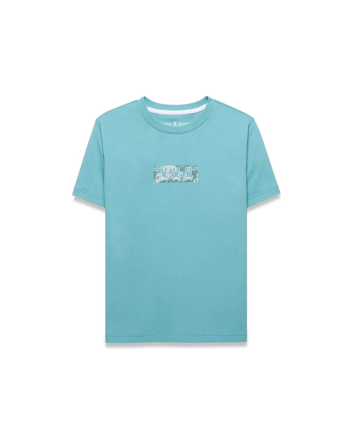 Kids' Alfie Back Graphic Tee in aqua blue, featuring a classic fit and smooth jersey knit. A rectangular center chest graphic displays repeating white and grey Psycho Bunny skull logos. (1)
