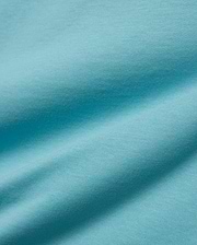 Kids' Alfie Back Graphic Tee in vibrant aqua blue, soft jersey knit fabric with subtle texture and flowing drapes, featuring a back graphic for a stylish, comfortable look. (5)
