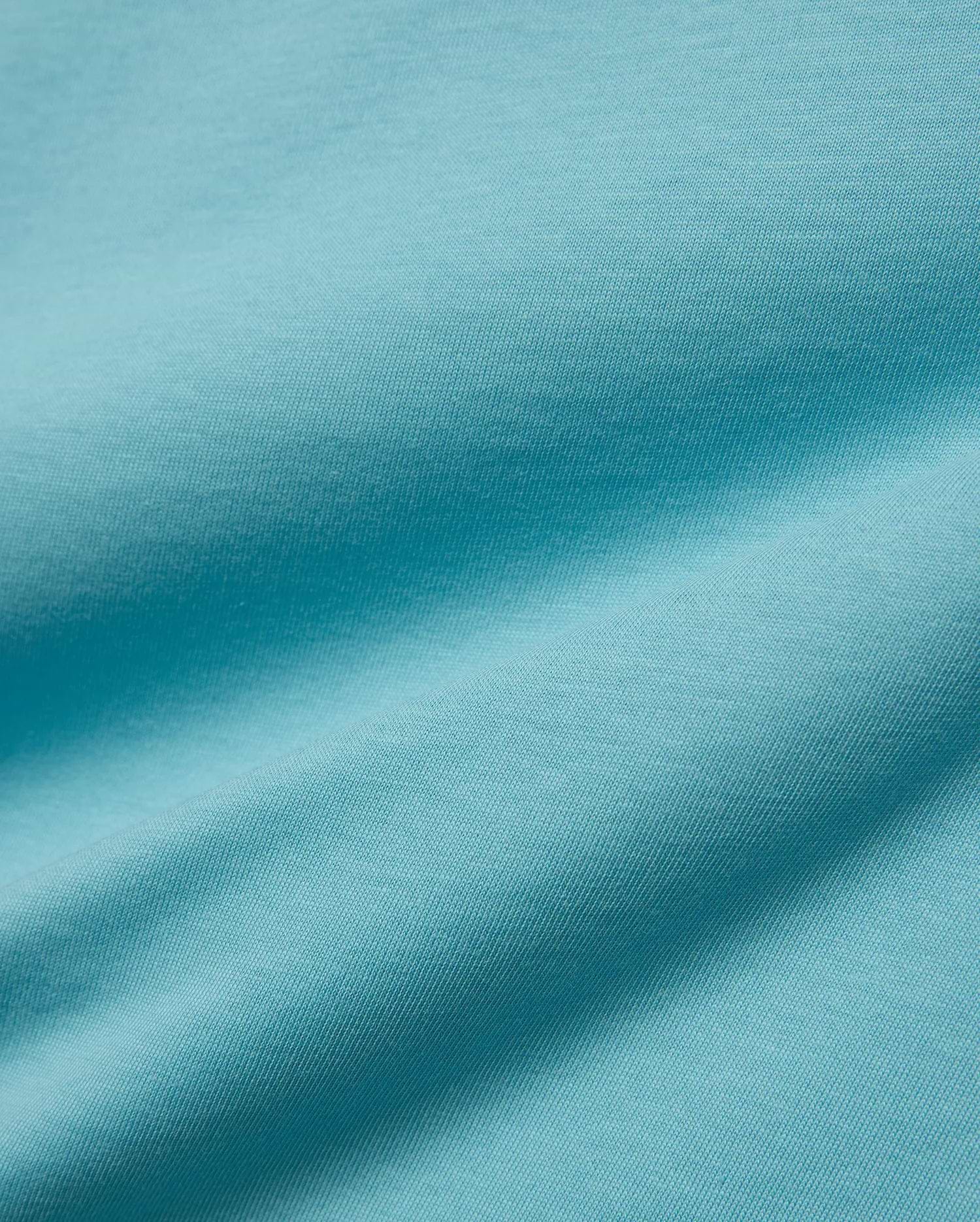 Kids' Alfie Back Graphic Tee in vibrant aqua blue, soft jersey knit fabric with subtle texture and flowing drapes, featuring a back graphic for a stylish, comfortable look. (5)