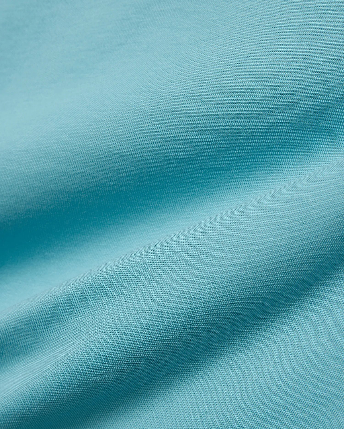 Kids' Alfie Back Graphic Tee in vibrant aqua blue, soft jersey knit fabric with subtle texture and flowing drapes, featuring a back graphic for a stylish, comfortable look. (5)