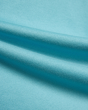 Kid's Norman Longsleeve Oversized Tee in vibrant aqua blue, showcasing its premium, finely woven cotton jersey knit fabric with soft, flowing drapes. (6)