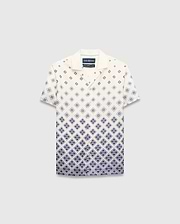 Kids Tobias Tencel Shirt in cream with a navy blue gradient diamond pattern featuring the Psycho Bunny skull logo, a relaxed fit, camp collar, and button-front.