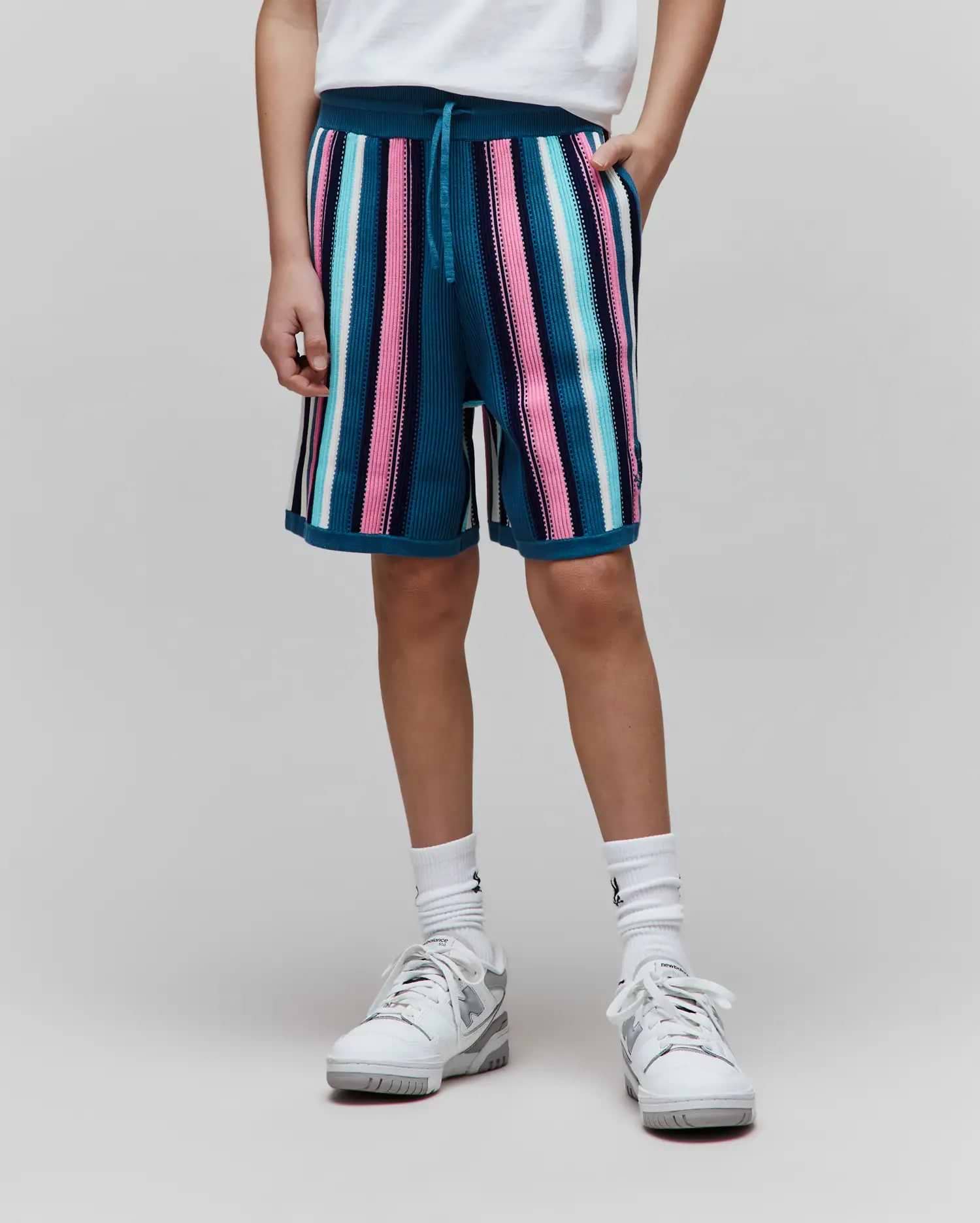 Kids Cliff Knit Short, a relaxed fit teal knit short with a distinct ribbed texture, showcasing bold vertical stripes in varying widths of vibrant pink, sky blue, crisp white, and deep navy. (1)