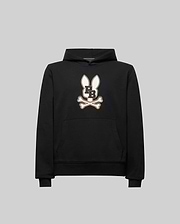 The Psycho Bunny KIDS WADE CORD PATCH HOODIE (KT0500031) is a black athletic hoodie in a premium cotton blend, featuring an embroidered long-eared Bunny patch with "PB" on the chest, shown on a plain gray background.