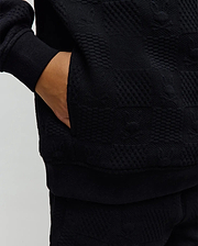 Black Kids Dustin Hoodie featuring a premium quilted knit texture, classic fit, ribbed cuffs and hem, and convenient side pockets, embodying refined streetwear style. (3)