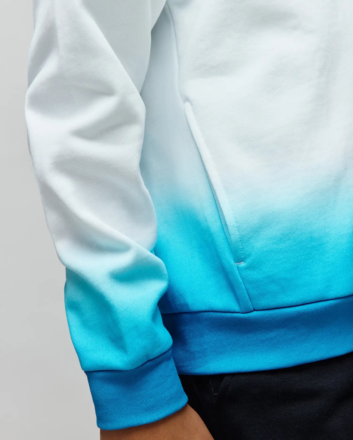 Kids Dax Oversized Hoodie in soft French terry, showcasing a striking white to turquoise and deep blue ombre gradient, with comfortable ribbed cuffs and hem.