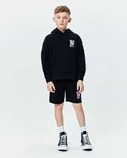Black Kids Isaac Print Hoodie and matching shorts, relaxed fit french terry, featuring a small colorful Psycho Bunny skull logo print on the left chest and left thigh.