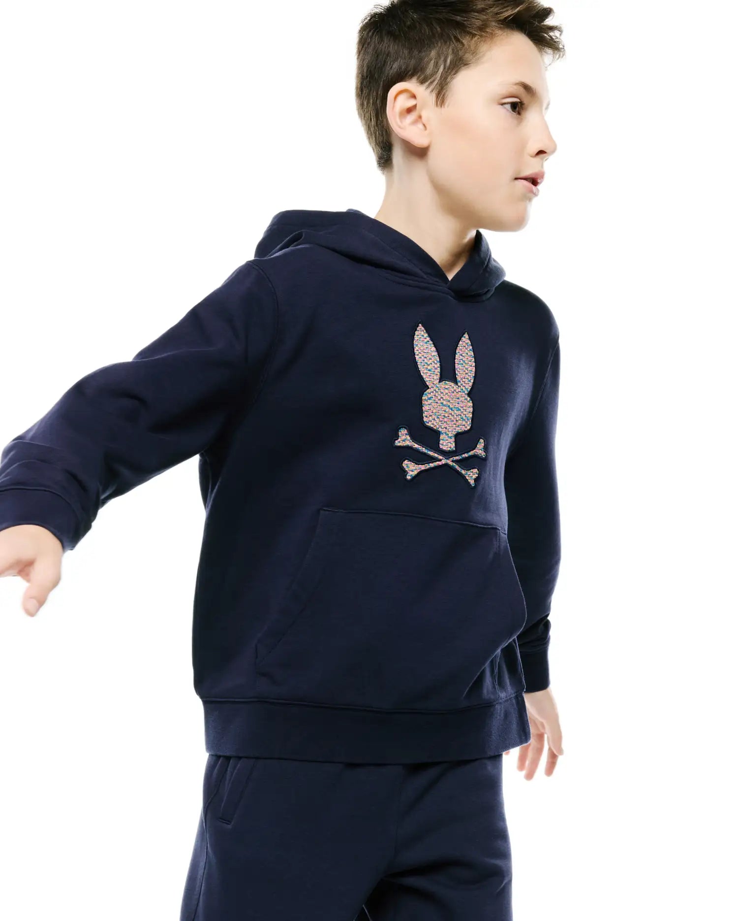 Kids Darcy Hoodie, navy relaxed fit French terry hoodie with a large, colorful speckled embroidered Psycho Bunny skull logo on the chest and a front kangaroo pocket.
