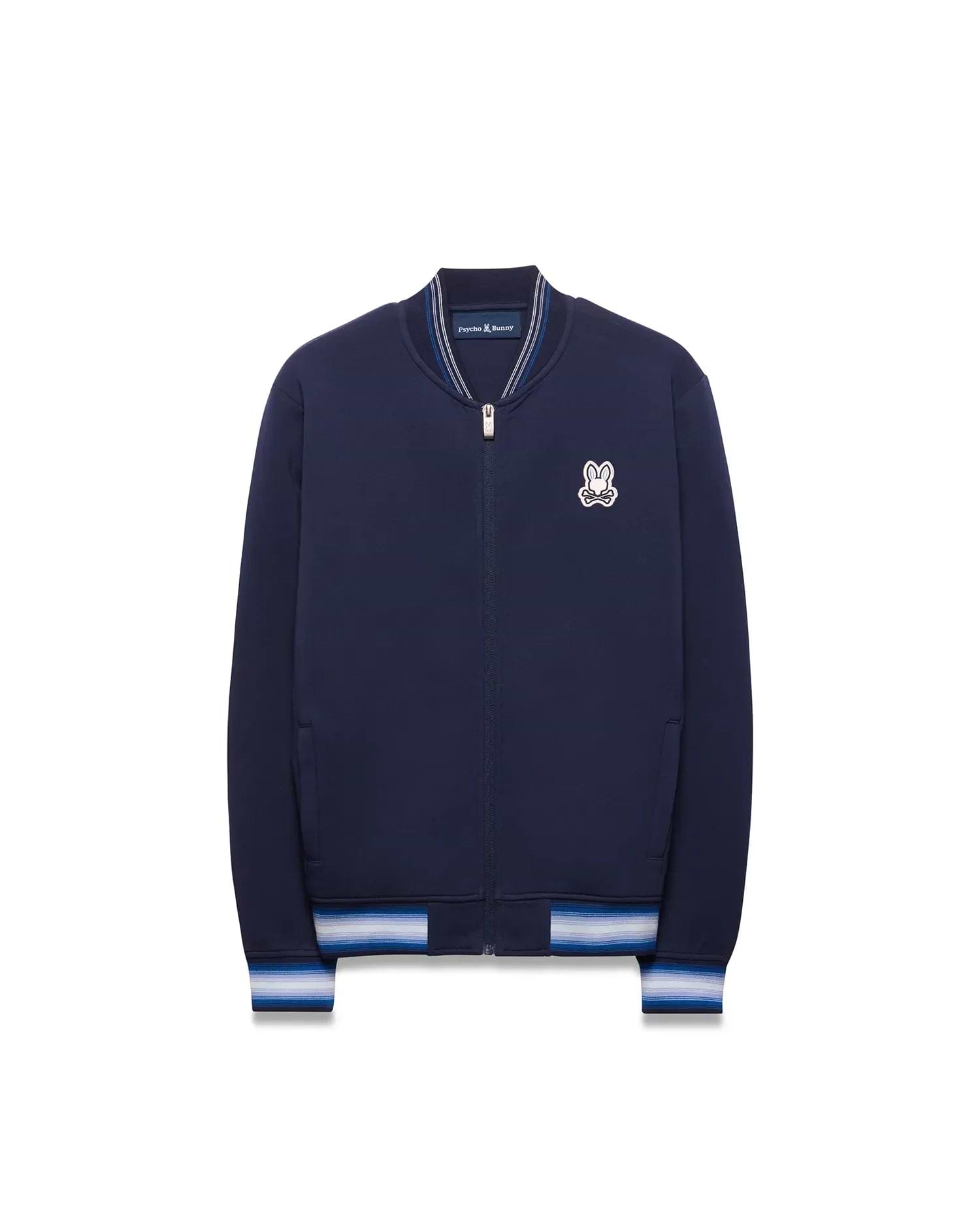 Kids Jaydon Track Jacket in navy blue, featuring a full zip, ribbed collar, and striped cuffs in white and light blue, with an embroidered Psycho Bunny skull logo on the left chest.