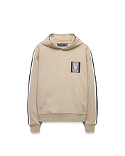 Kids Ty French Terry Hoodie in beige, featuring navy and white sleeve stripes, a front kangaroo pocket, and a small embroidered Psycho Bunny skull logo patch on the left chest.
