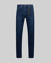 Mens Emerson Denim Pant, dark blue denim jeans with a classic fit, featuring a bright green Psycho Bunny logo tag on the coin pocket and a branded hang tag on the belt loop.